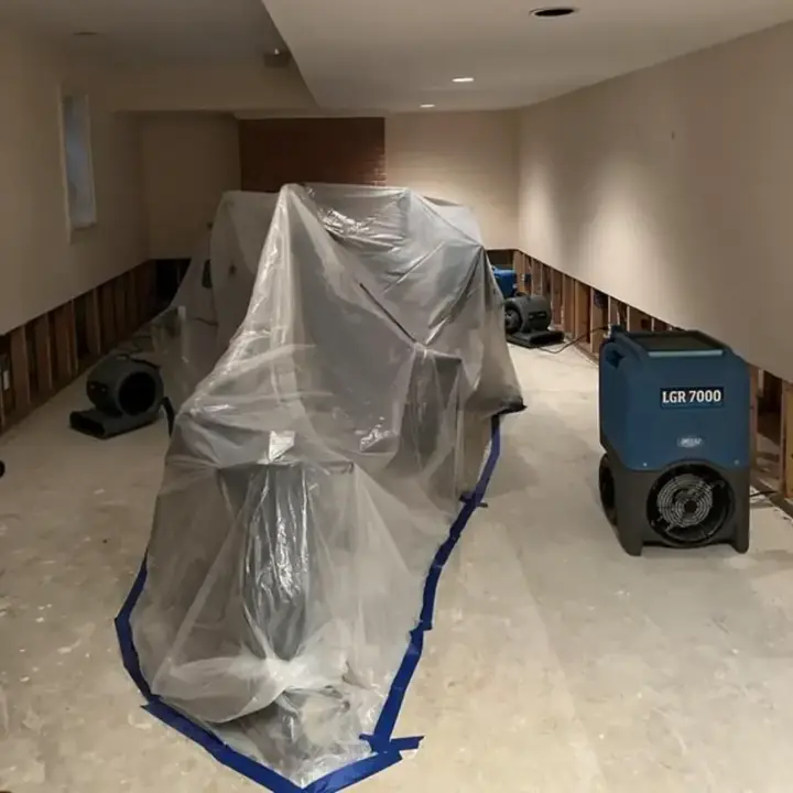 Containment plastic and an LGR dehumidifier drying a room with the lower walls opened in Vacaville