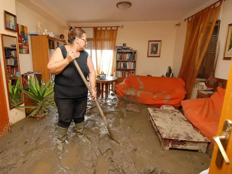 Muddy storm floodwater across a living room floor after a winter storm near Vacaville